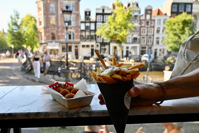 10 Tastes of Amsterdam: Food Tour by UNESCO Canals and Jordaan - Stroopwafels at Hans Egstorf, plus the hidden-garden tease