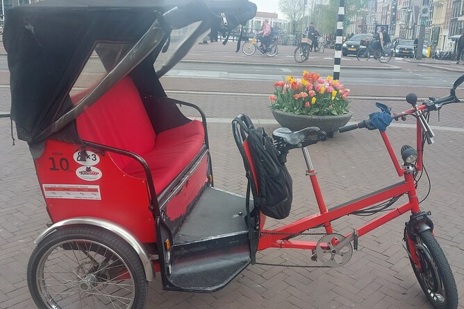 2 Hours Private Amsterdam Rickshaw Tour - Dam Square to the Red Light District, seeing two Amsterdam faces in one ride