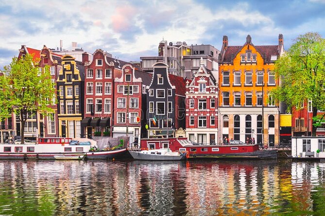 5 hrs Golden Age Amsterdam Private Walking Tour With Local Guide - Start at Amsterdam Centraal: poles, power, and quick orientation