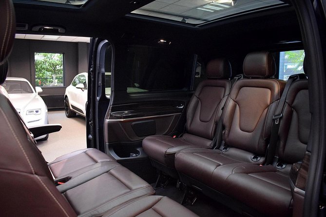 Airport or Port transfer Business Class (private car service) - Pickup, name sign meeting points, and how contact works