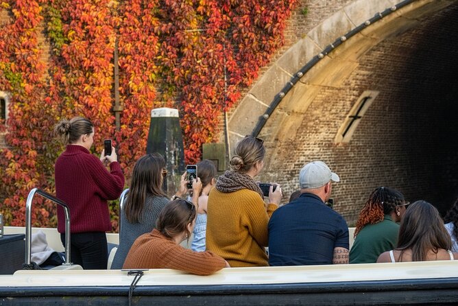 Amsterdam 1-Hour Canal Cruise With Live Guide - Jordaan charm and houseboat life: a quieter look at real Amsterdam living