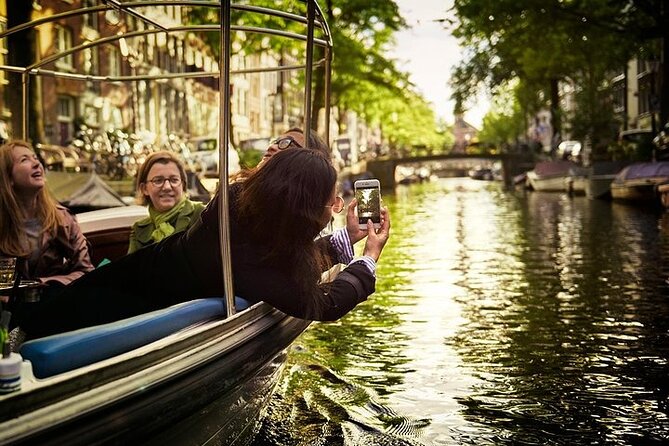 Amsterdam 2-hour Private Canal Cruise with Live Guide and Drinks - Jordaan: the calmer side with narrow canals and 17th-century character