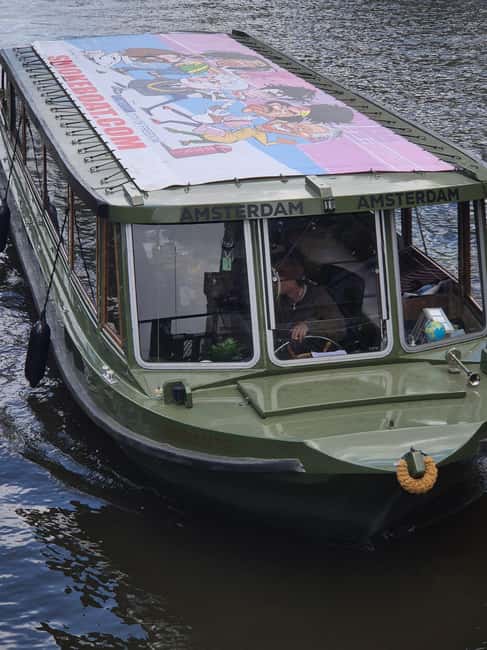 Amsterdam: 420 Smoke-Friendly Boat Tour - Arriving at the pier near Amsterdam’s Red Light District