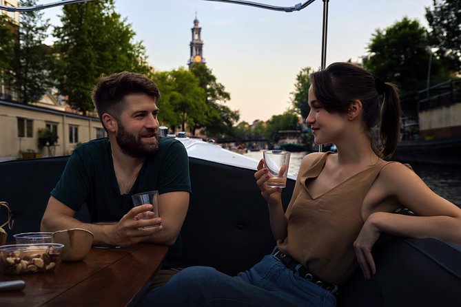 Amsterdam: 60-Minute Guided Private Canal Cruise with Drinks - Boarding at Prinsengracht: location advantage and what to expect