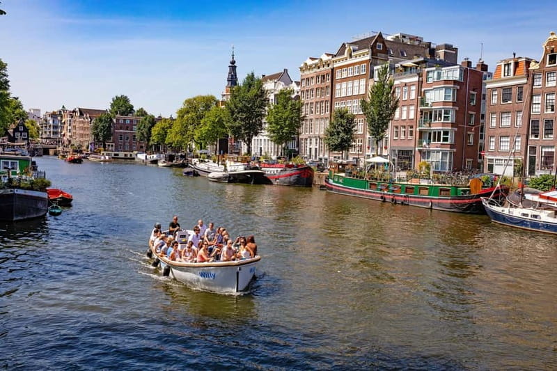 Amsterdam: 75 minute Open Boat Canal Cruise with Live Guide - UNESCO canal views, plus Westerkerk, Anne Frank House, and Magere Brug