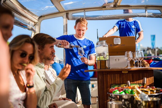 Amsterdam: Canal Booze Cruise with Unlimited Drinks Option - Weather and timing: what to expect when it rains