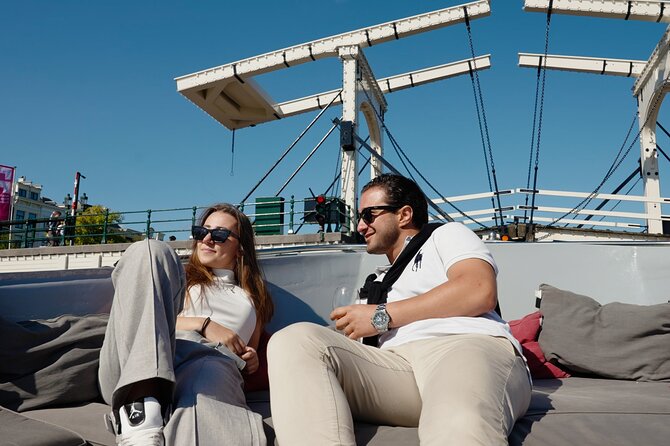Amsterdam Canal Cruise with Dutch Pancakes and Drinks - Working-Class Neighborhoods, Shopping Views, and Oscar Carre Theatre