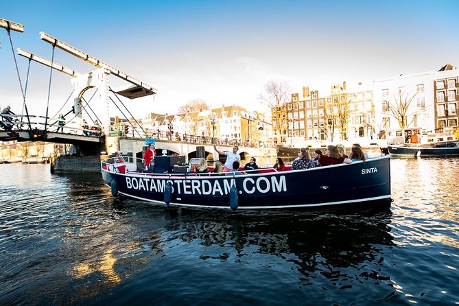 Amsterdam Canal Cruise With Live Guide and Unlimited Drinks - Unlimited drinks plus warm winter seating and smart extras
