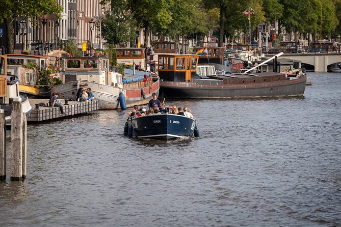 Amsterdam Canal Cruise with Live guide & Two drinks - Central St. - The canal route: Old City Centre, small canals, red-light district area, Church, and Central Station