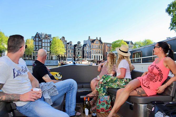 Amsterdam Canal Tour by Open Boat – 90 min Small Group Experience - A smart 90-minute Amsterdam canal cruise, without the big-boat feel