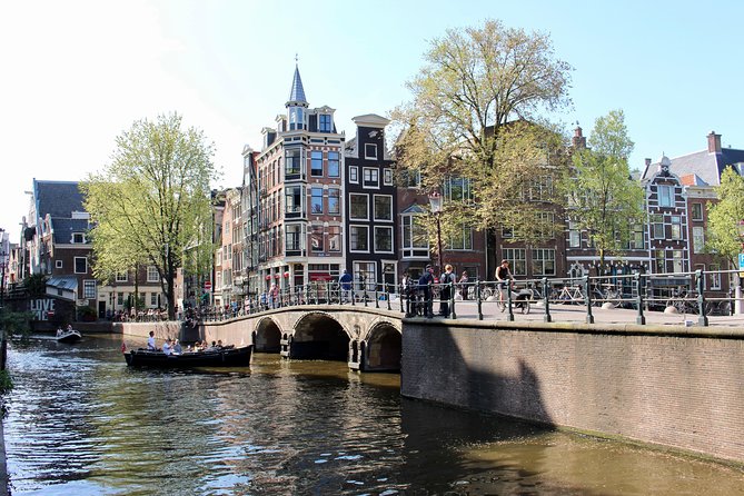 Amsterdam Canal Tour by Open Boat – 90 min Small Group Experience - Comfort and weather: what to expect on the water
