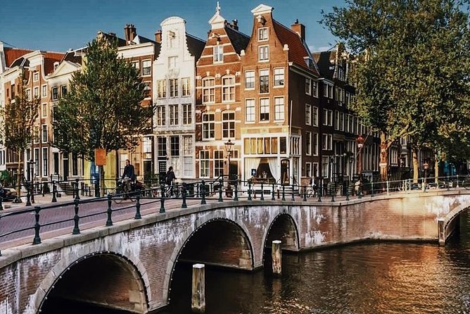 Amsterdam City Center & History - Exclusive Guided Walking Tour - St. Nicholas Basilica to the Weeping Tower, a City Shaped by Faith and Farewells