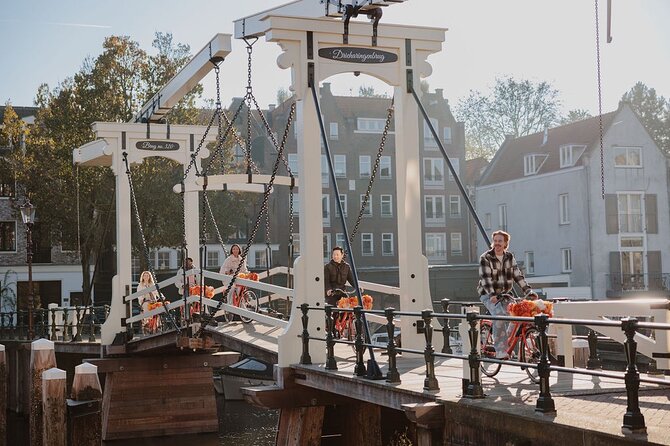 Amsterdam City Top Highlights Guided Bike Tour - Getting going at Nieuwezijds Voorburgwal (and fitting your bike fast)