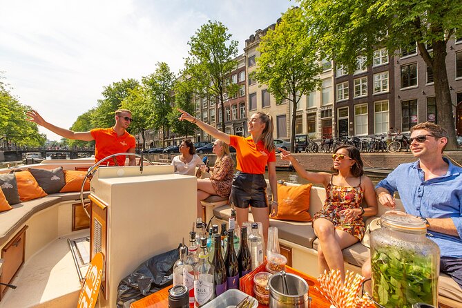 Amsterdam Classic Saloon Boat Canal Cruise with Live Guide - Amstel River cruising: the city’s lifeline from the water