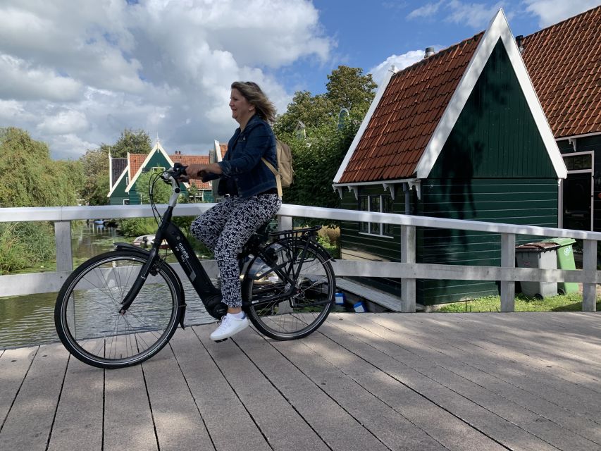 Amsterdam: Countryside Bike Tour and Zaanse Schans Windmills - Monet’s wetlands and Domineestuin wooden houses