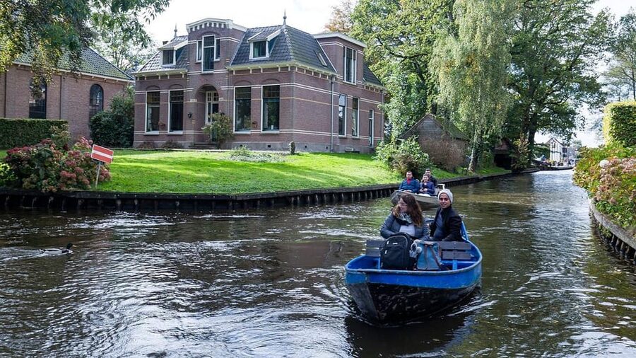 Amsterdam: Explore Giethoorn in a Private Tour with Driver - Walk the Canals: Bridges, Gardens, and Thatched Roof Charm