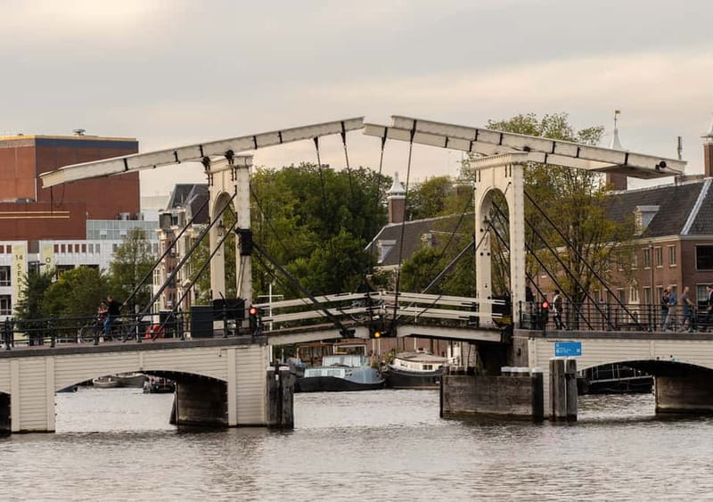 Amsterdam: German Canal Cruise with Unlimited Drinks Option - Stop by Stop: What You See Along the Route