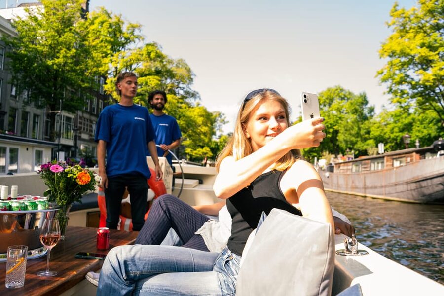 Amsterdam: German Guided Canal Cruise with on Board Bar - The German host storytelling, and what you learn as you pass landmarks