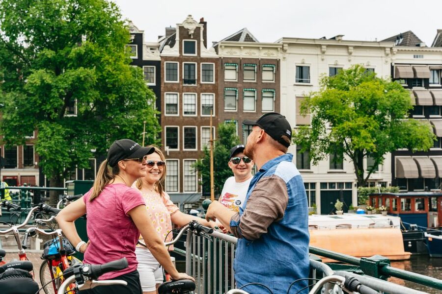 Amsterdam: Guided Bike Tour City Centre in EN/DE/FR/ES - Het Scheepvaartmuseum area, Artis Zoo, and Salt Harbour’s VOC-era ship replica