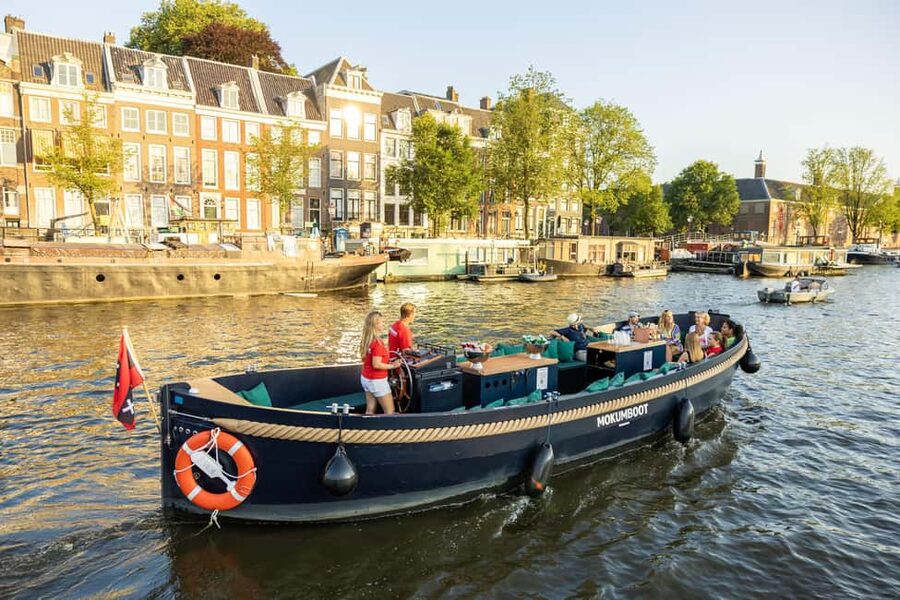 Amsterdam: Guided Open Boat Canal Cruise Including Drink - Entering Amsterdam From the Water on an Open Electric Boat