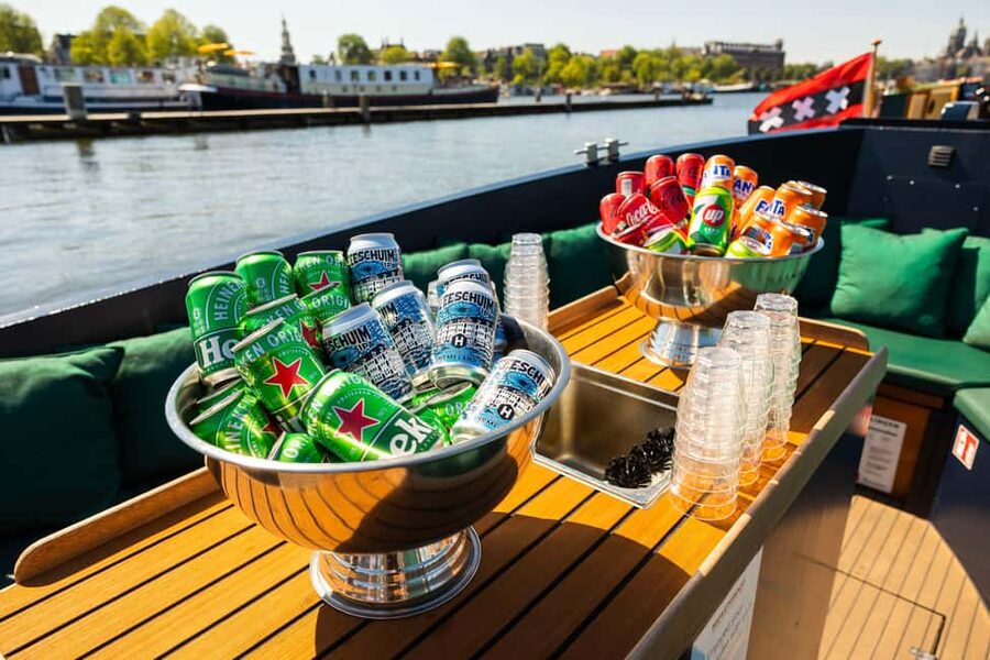 Amsterdam: Guided Open Boat Canal Cruise Including Drink - Getting to the Boat: Central Station Pickup and What to Watch For