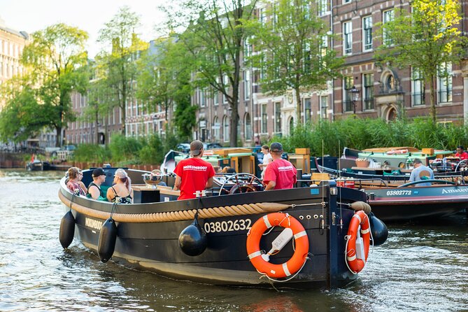 Amsterdam: Guided Open Boat Canal Cruise Unlimited Drinks Option - Rembrandt, Opera, and the Flea Market: Culture Hits While You Float