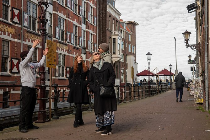 Amsterdam: History, Culture & Highlights tour - Damrak to Dam Square: the political heart you can feel immediately