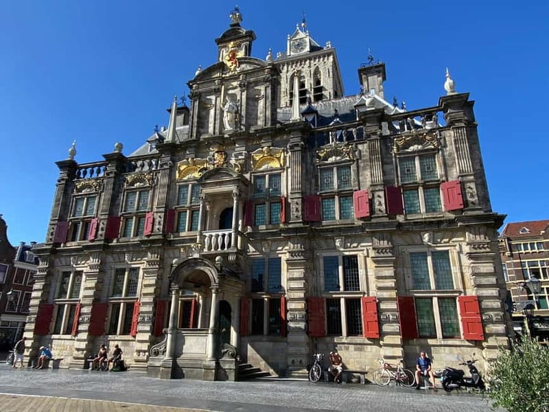 Amsterdam: Kinderdijk, Euromast, Delft and Den Haag Day Tour - Delft’s canals and gables: the old town break you actually feel