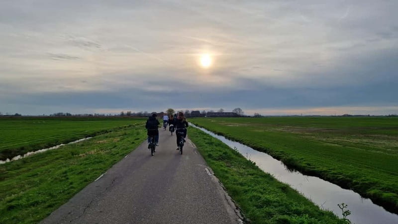 Amsterdam: Leisurely Windmill & Countryside Bike Ride - North Holland Canal Riding and the First Windmill Moment