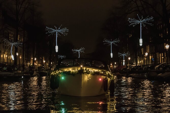 Amsterdam Light Festival: Canal Cruise + Snack & Unlimited Drinks - Covered-Boat Views: Plastic Windows, Glare, and How to Stay Warm
