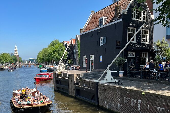 Amsterdam Luxury Boutique Boat tour with Unlimited Beer and Wine - Guides in English, and How Stories Land in 45 Minutes