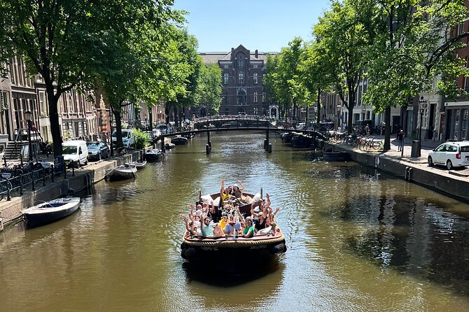 Amsterdam Luxury Boutique Boat tour with Unlimited Beer and Wine - De Wallen from the Water, plus Oude Kerk Details You Can Actually Spot