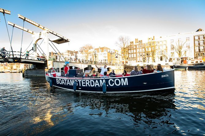 Amsterdam Open Boat Cruise with Live Guide and Two Drinks - Comfort tips that matter: umbrellas, fogged windows, and what to wear