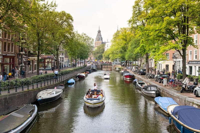 Amsterdam: Open Boat Tour of Canals with Expert Local Guide - The 1-Hour Route: Centraal, Prinsengracht, Rijksmuseum, and Magere Brug
