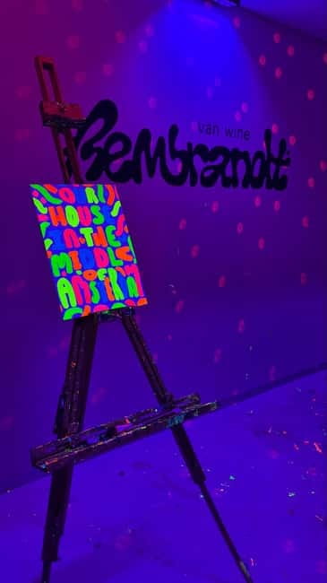 Amsterdam: Paint and Sip in the Dark at Rembrandt van Wine - Neon paint, in-the-dark fun that still feels structured
