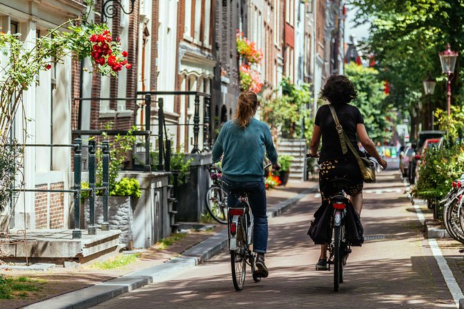 Amsterdam PRIVATE Bike Tour With Locals: Bike & Local Snack Included - Stop 1: Westerkerk and the look of Protestant Amsterdam