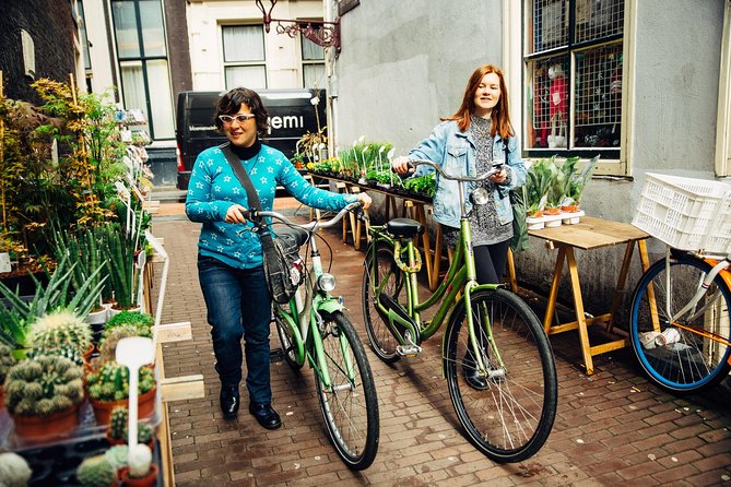 Amsterdam PRIVATE Bike Tour With Locals: Bike & Local Snack Included - The long ride through neighborhoods, canals, and street life
