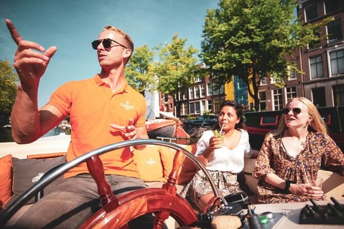 Amsterdam Private Boat Tour with Unlimited Drinks - Red Light District edges, oldest buildings, and older canals with personality