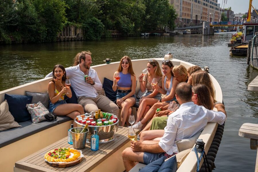 Amsterdam: Private Canal Booze Cruise with Unlimited Drinks - The guide and skipper dynamic: why it matters on a private boat