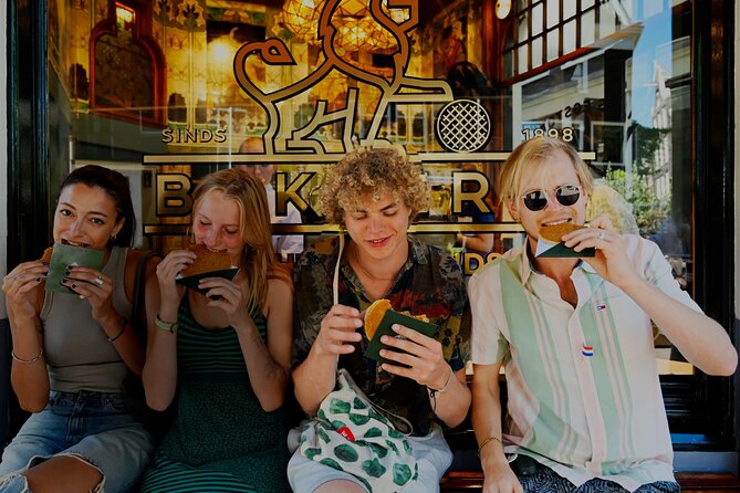 Amsterdam Private Food & Drinks Tour by UNESCO Canals & Jordaan - Flower Market, Spui university, and a secret garden pause