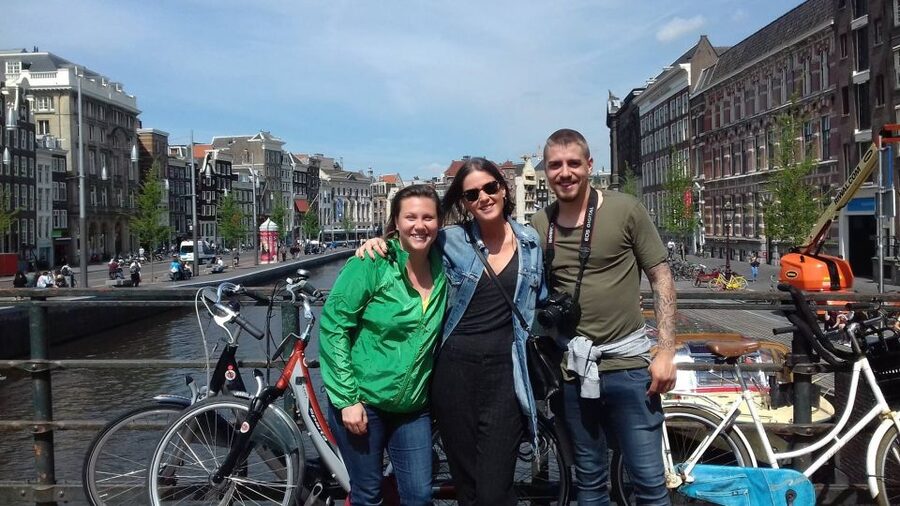 Amsterdam: Private Guided Walking Tour - Begijnhof and the atmosphere shift toward old Amsterdam life
