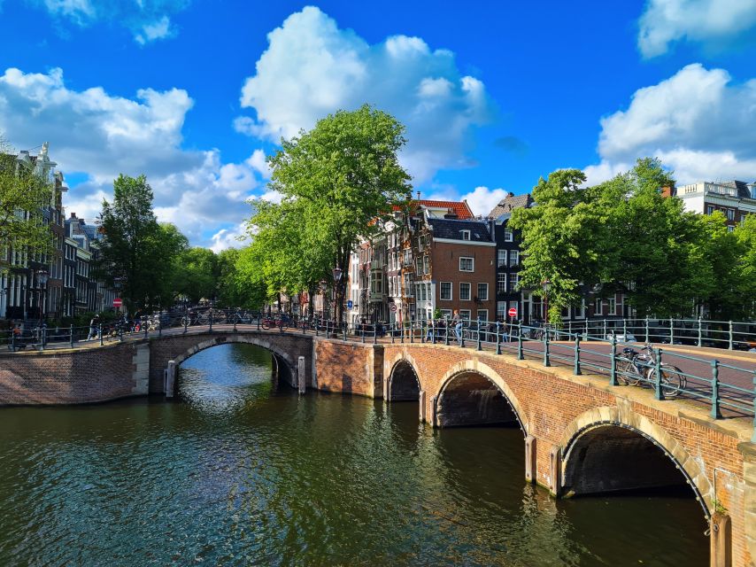 Amsterdam: Private Pedicab Historical Sightseeing Tour - New Market Square and Montelbaanstoren: defenses, canals, and lookout moments
