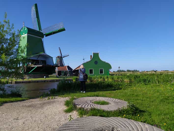 Amsterdam: Rainbow Rural Bike Tour With Local Gay Guide - The abandoned harbor murals, where art fills spaces meant for work