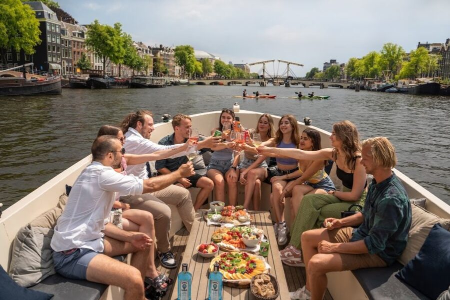 Amsterdam: Red-Light District Pub Crawl and Booze Boat Tour - Drinking games, pacing, and how to avoid a rough night