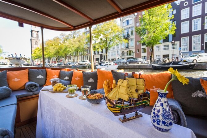 Amsterdam Small-Group Bike Tour With Canal Cruise, Drinks, Cheese - Around ARTIS Zoo, then crossing the city’s narrowest bridge by bike