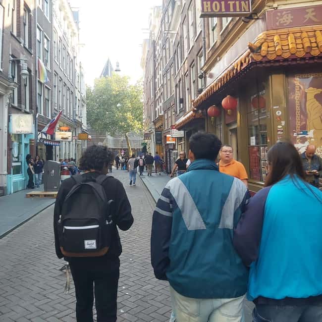 Amsterdam: Spanish Tour Unmasking the Redlight District - He Hua Tempel and Unexpected Sides of Amsterdam