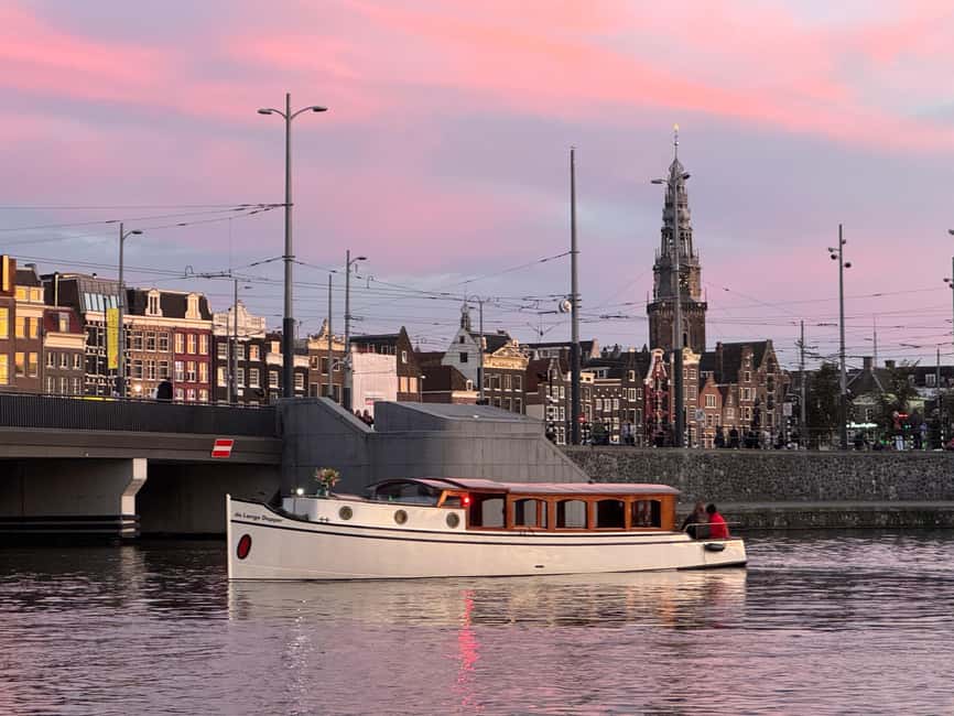Amsterdam: The Bulldog Boat Smoke and Booze Cruise - Onboard vibe: a half-open boat, and why that matters