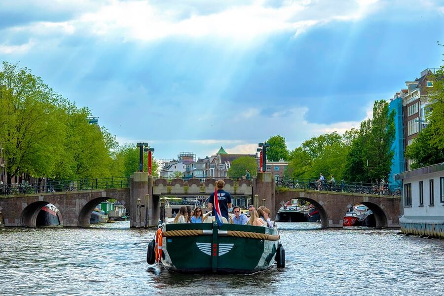 Amsterdam: The Newest Canal Cruise with Drink Option - Finding Eco Boats at the water, right by Central Station