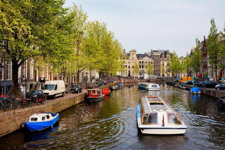 Amsterdam Walking Tour and Canal Cruise - Dam Square, royal power, and the West Church corner