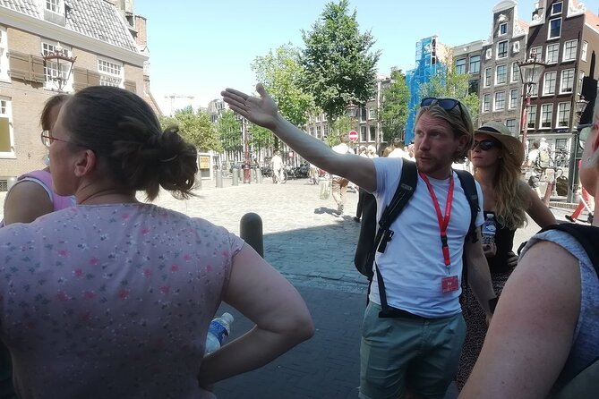 Amsterdam Walking Tour with a local comedian as guide - Stop 4: Grimburgwal canals and the funny side of city messaging